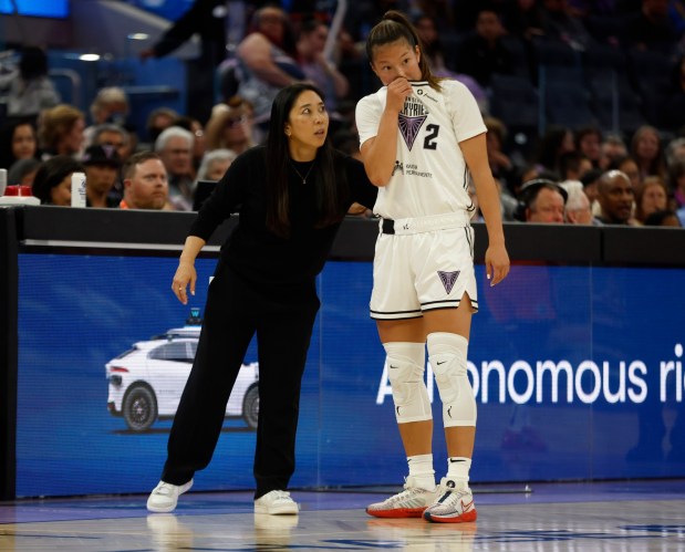 Golden State Valkyries head coach Natalie Nakase (35) talks to Golden State Valkyries' Kaitlyn Chen (2) during their game against the Connecticut Sun in the second quarter at the Chase Center in San Francisco, Calif., on Sunday, June 22, 2025. (Nhat V. Meyer/Bay Area News Group)