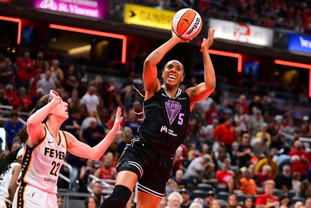 Golden State Valkyries' Kayla Thornton (5) shoots against Indiana Fever's Caitlin Clark (22) during the first half of a WNBA basketball game, Wednesday, July 9, 2025, in Indianapolis. (AP Photo/Doug McSchooler)