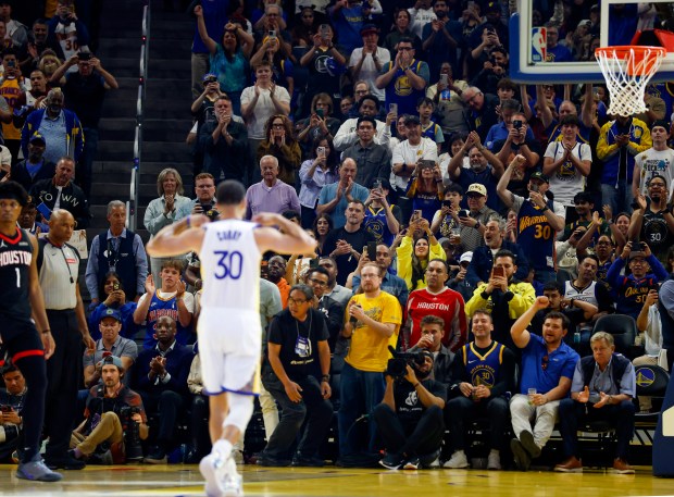 Basketball fans cheer as Golden State Warriors' Stephen Curry (30) is introduced as he comes into the game during their game against the Houston Rockets in the first quarter at the Chase Center in San Francisco, Calif., on Sunday, April 5, 2026. (Nhat V. Meyer/Bay Area News Group)