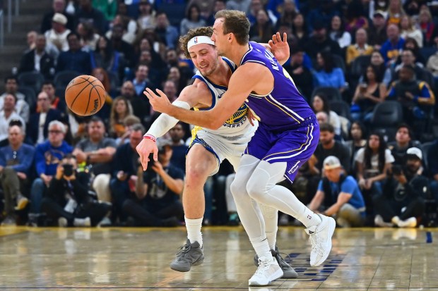 Golden State Warriors' Brandin Podziemski (2) guards Los Angeles Lakers' Christian Koloko (10) in the first quarter of their NBA game at Chase Center in San Francisco, Calif., on Thursday, April 9, 2026. (Jose Carlos Fajardo/Bay Area News Group)