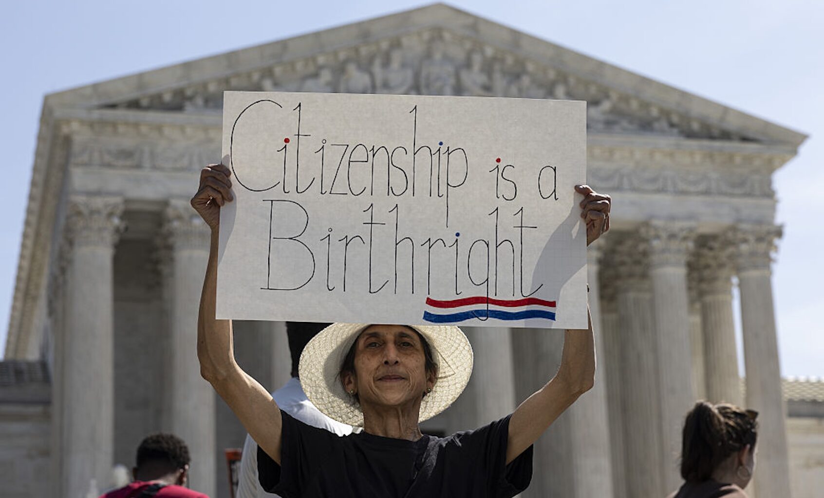 Demonstrators rally in support of birthright citizenship outside the Supreme Court (Mehmet Eser/Anadolu via Getty Images)
