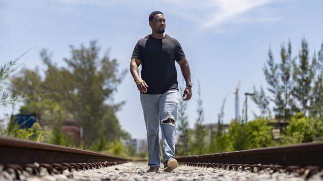 Darren Brown, a former Brightline train conductor, visits train tracks near the Northwood Art and Music Warehouse on Thursday, July 31, 2025, in West Palm Beach, Fla.
