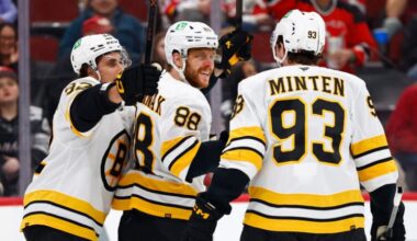 Boston Bruins right wing David Pastrnak (88) reacts with teammates Marat Khusnutdinov and Fraser Minten after scoring during the first period of an NHL hockey game against the New Jersey Devils, Monday, March 16, 2026, in Newark, N.J.
