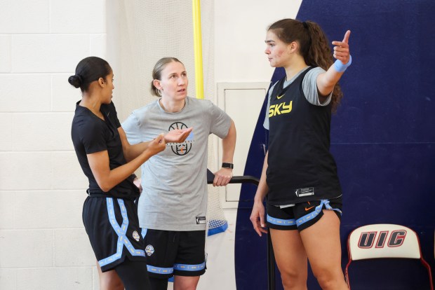 Chicago Sky players Skylar Diggins, from left, Courtney Vandersloot, and Maddy Westbeld chat on the sidelines during practice at UIC Flames Athletic Center on April 20, 2026. (Eileen T. Meslar/Chicago Tribune)