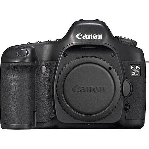A black Canon EOS 5D digital camera body with no lens attached, showing the Canon logo and EOS 5D branding on the front.