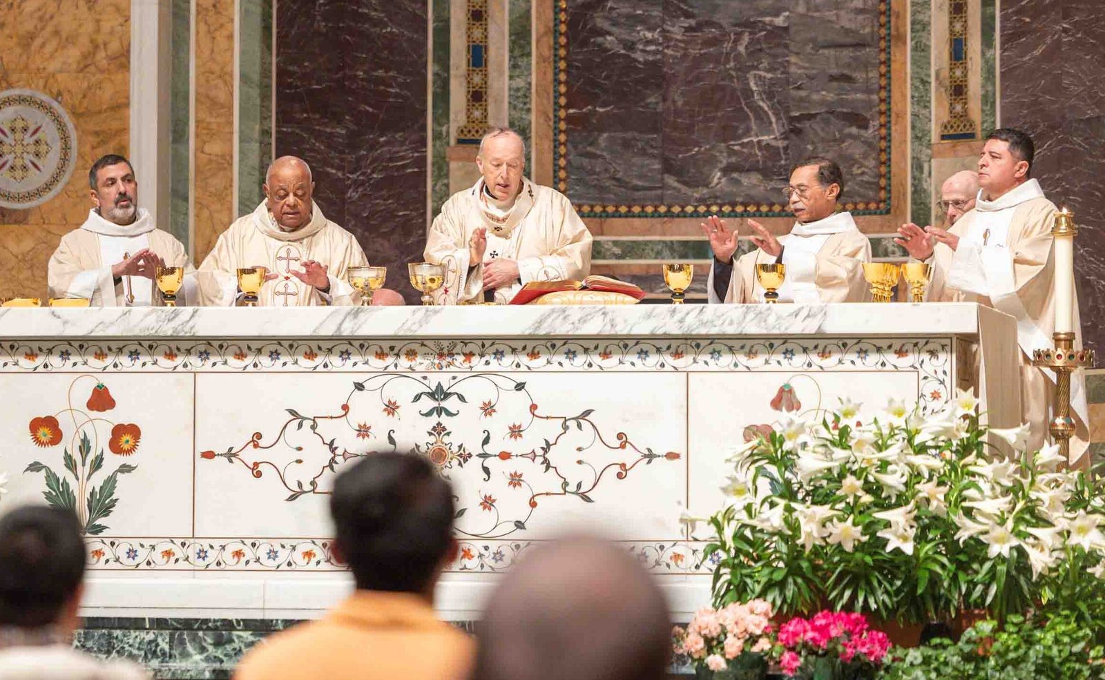 Cardinal Robert W. McElroy (at center) serves as the main celebrant at a Vigil Mass for Peace on April 11, 2026 at the Cathedral of St. Matthew the Apostle in Washington, D.C. To the left of the cardinal, the concelebrants at the Mass included Washington Auxiliary Bishop Juan Esposito and Cardinal Wilton Gregory, an archbishop emeritus of Washington. To the right of Cardinal McElroy, the concelebrants at the Mass also included Washington Auxiliary Bishop Roy Campbell Jr. and Washington Auxiliary Bishop Evelio Menjivar. (Catholic Standard photo by Mihoko Owada)