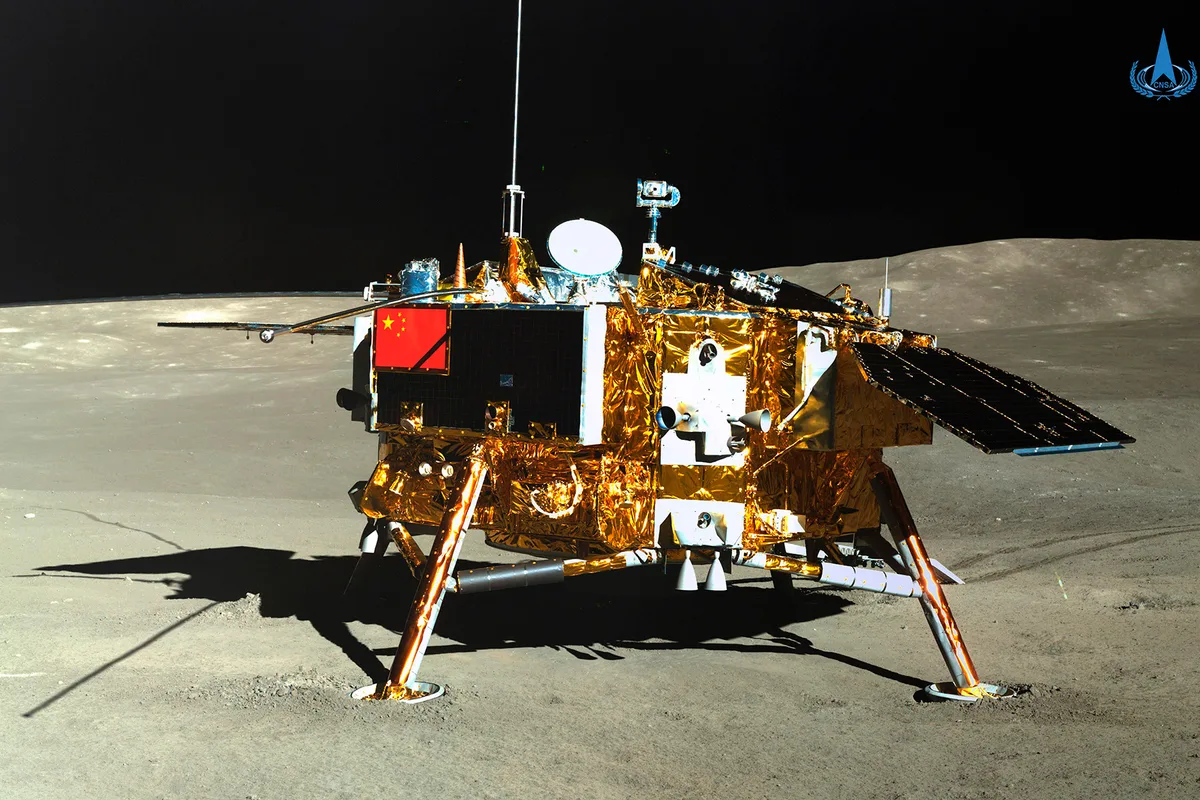 The Chang'e lunar lander with a Chinese flag on it on the surface of the Moon with the