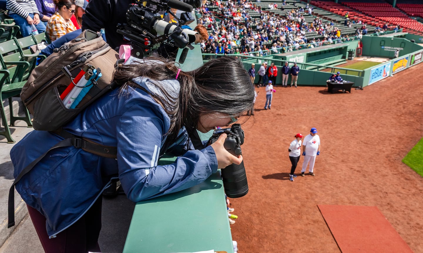 Caruso gets creative, shooting down from the bleachers at Fenway Park.
