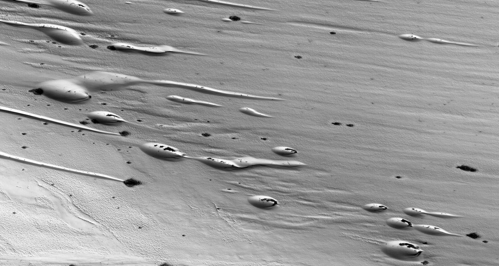 Ice melts in the springtime on Mars photo of the day for April 24, 2026