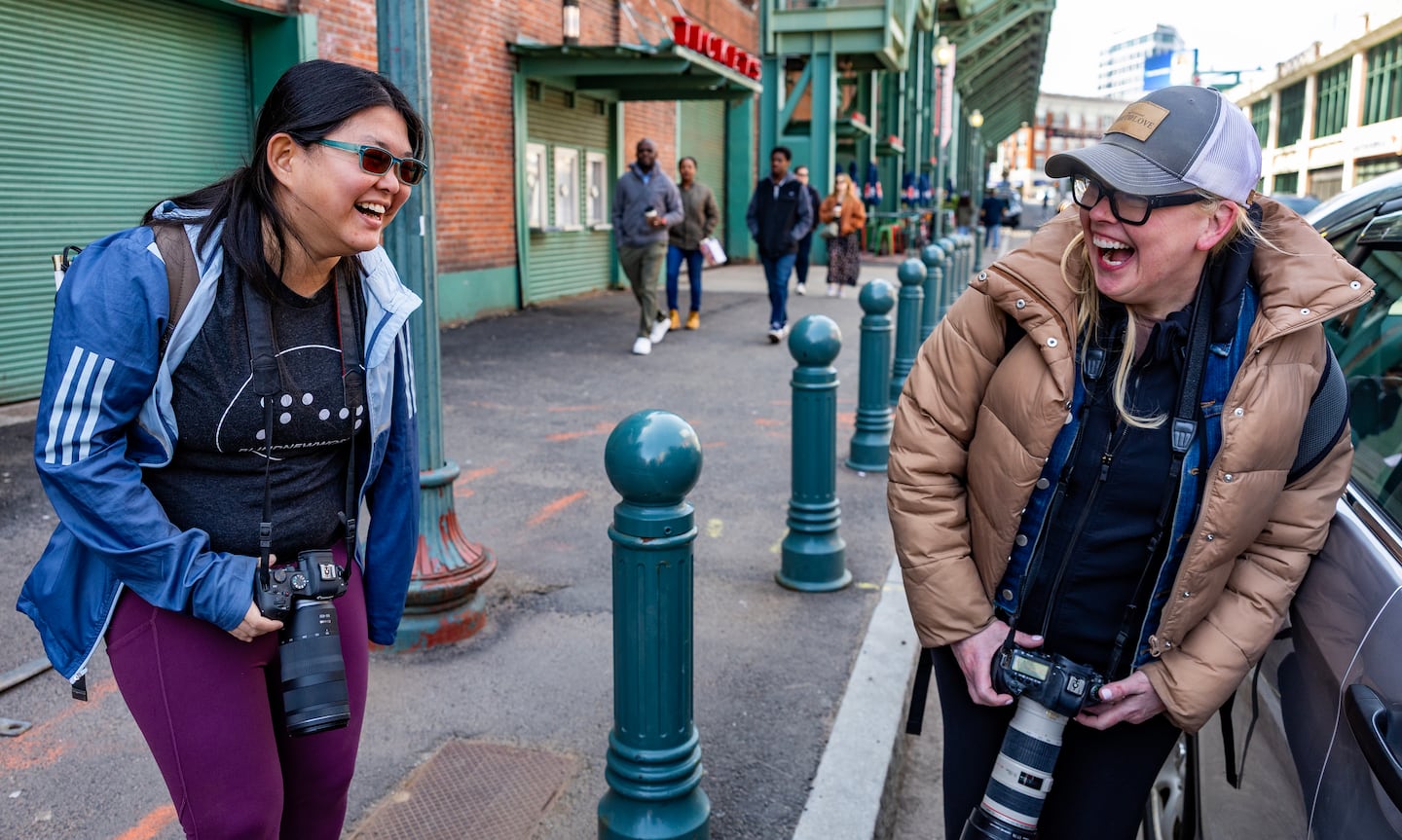 Caruso and one of her mentors, celebrity photographer Kerry Brett, laugh it up on Lansdowne Street.