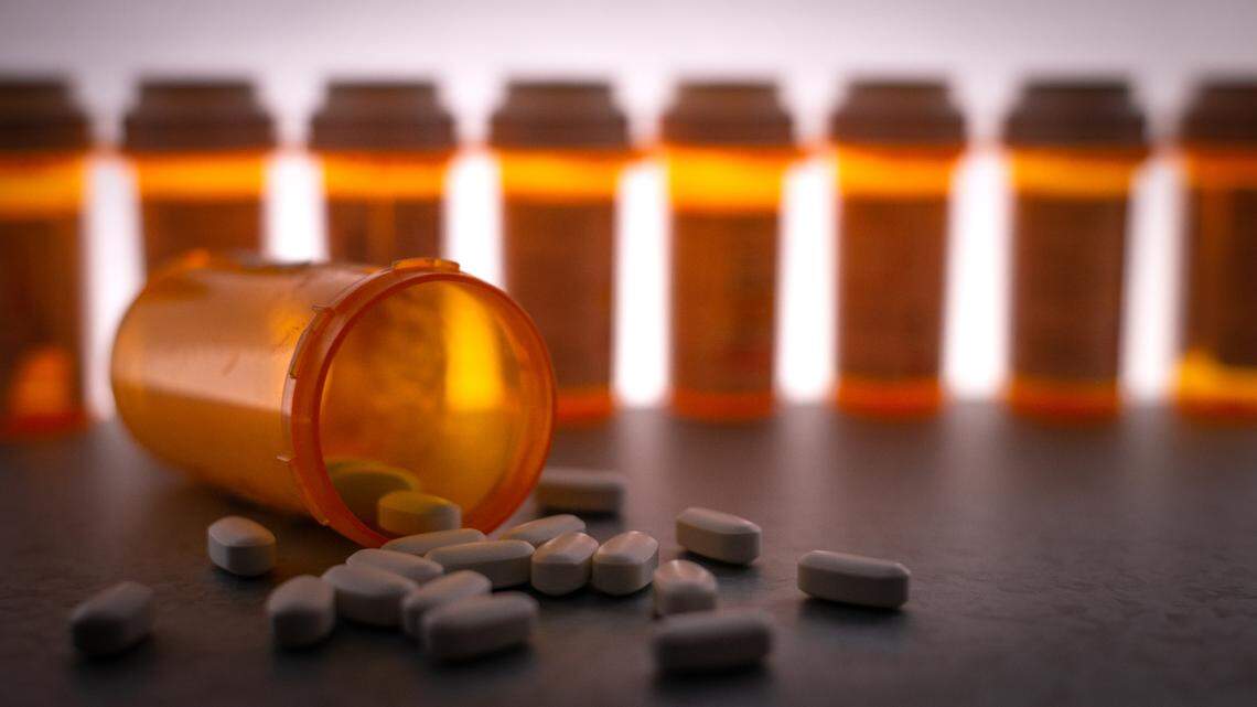 National Prescription Drug Take Back Day is Saturday, April 25. Prescription medication is strewn about, with pill bottles in the deep background.