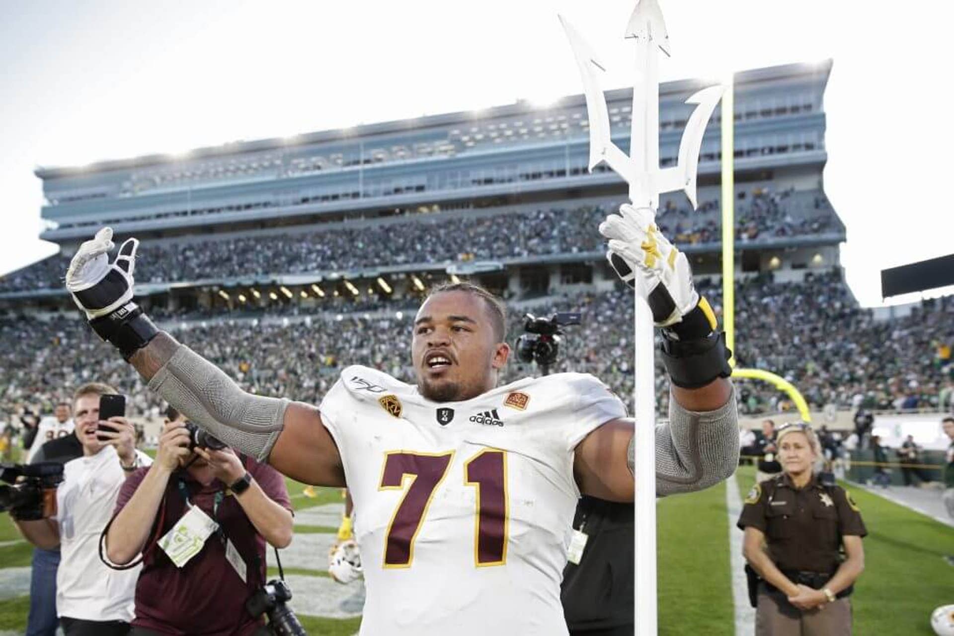 Steven Miller holds up the Arizona State pitchfork.