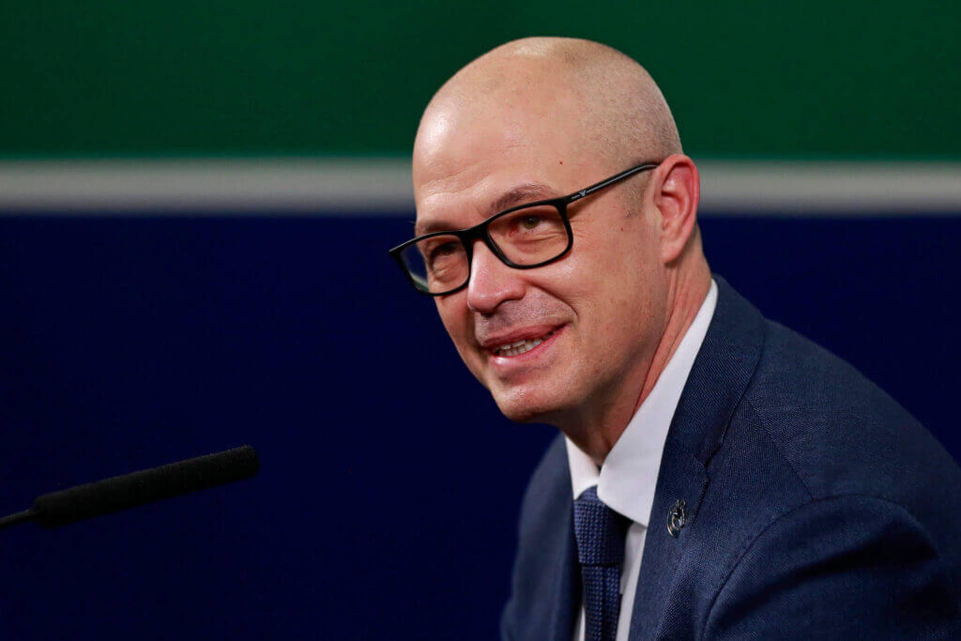 Vancouver Canucks general manager Patrik Allvin speaks at a podium.