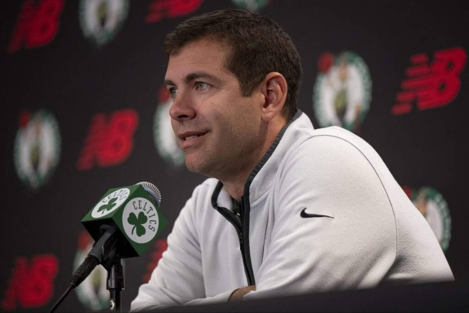 Brad Stevens sits during a news conference.