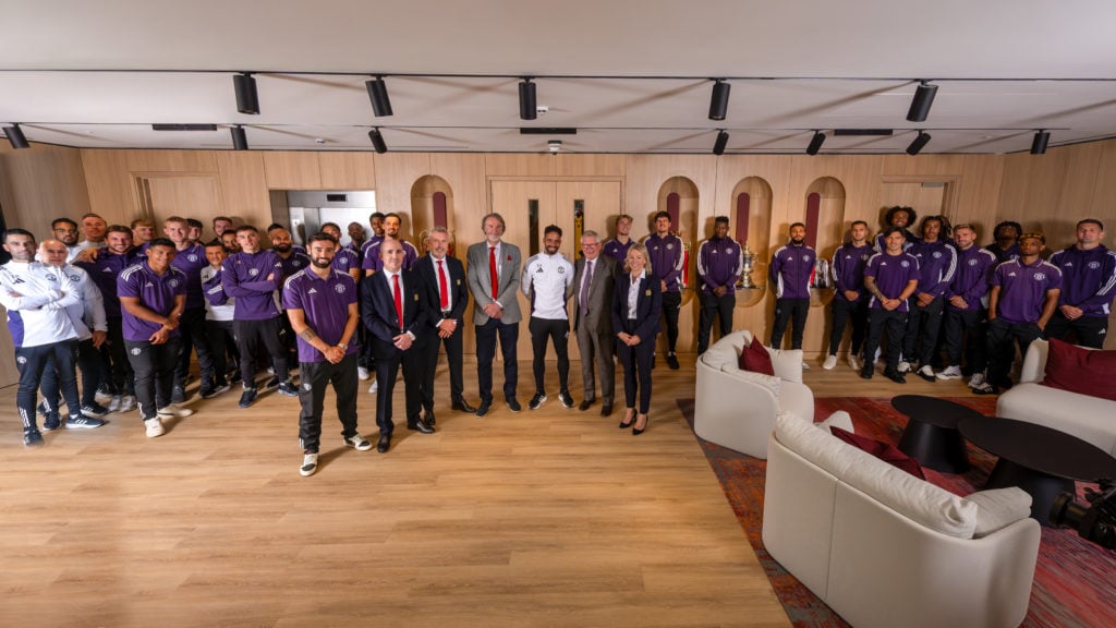 Man Utd team photo with staff at the launch of new Carrington