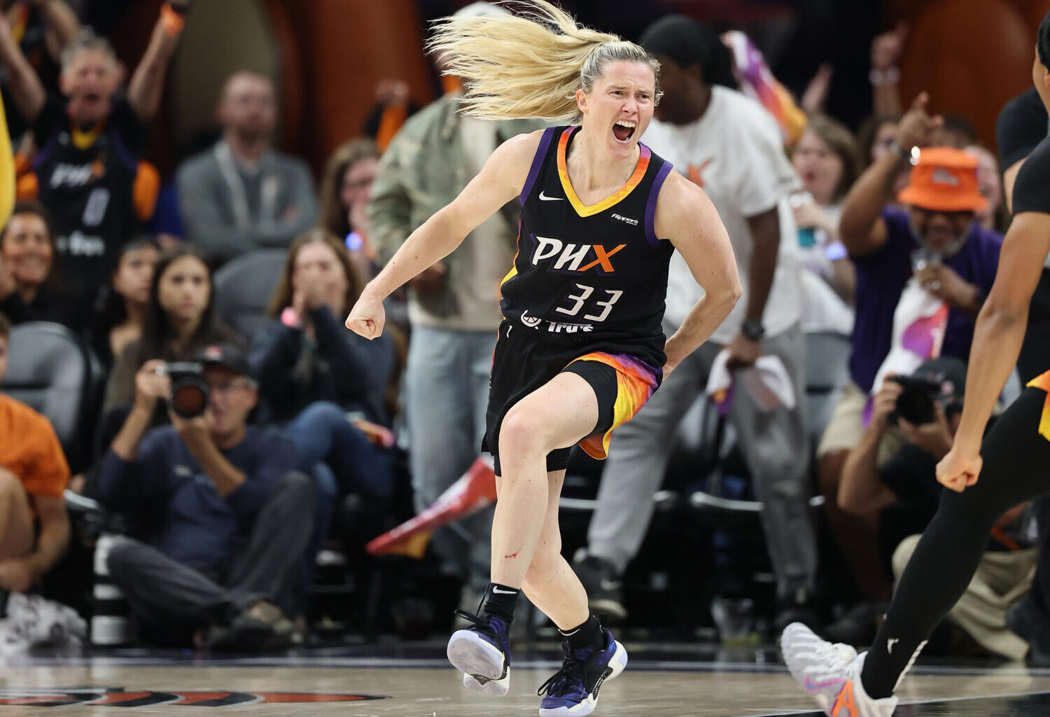PHOENIX, ARIZONA - SEPTEMBER 26: Sami Whitcomb #33 of the Phoenix Mercury celebrates after scoring ...