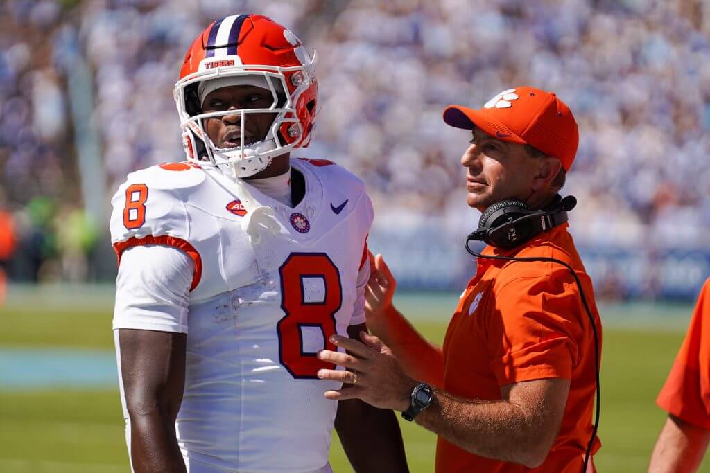 Former Clemson running back Adam Randall with coach Dabo Swinney.