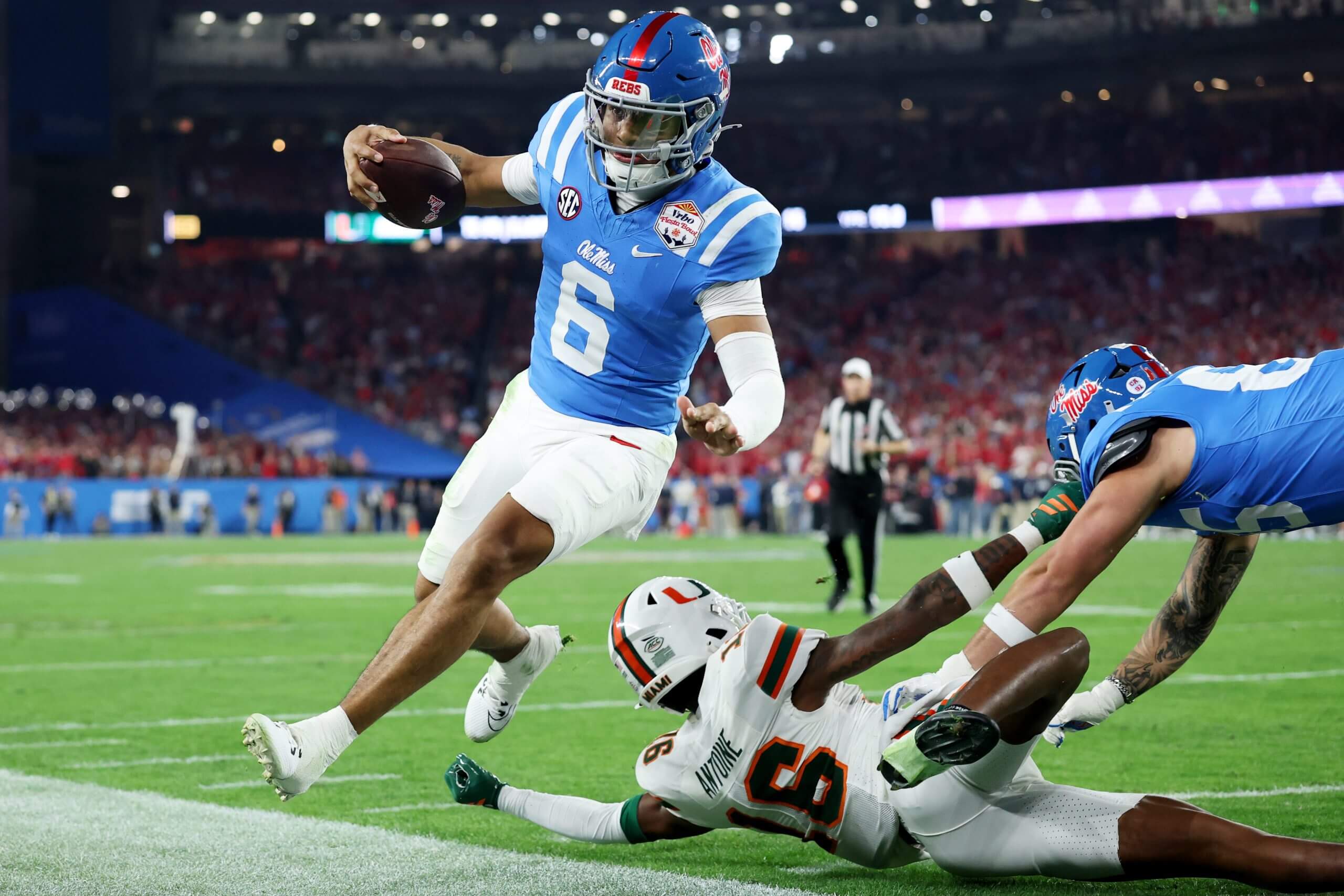 Trinidad Chambliss runs out of bounds.