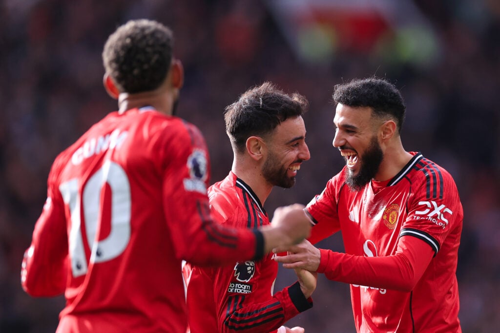 Bruno Fernandes celebrates with Noussair Mazraoui and Matheus Cunha during the Premier League match between Manchester United and Crystal Palace at Old Trafford in 2026 in Manchester, England.