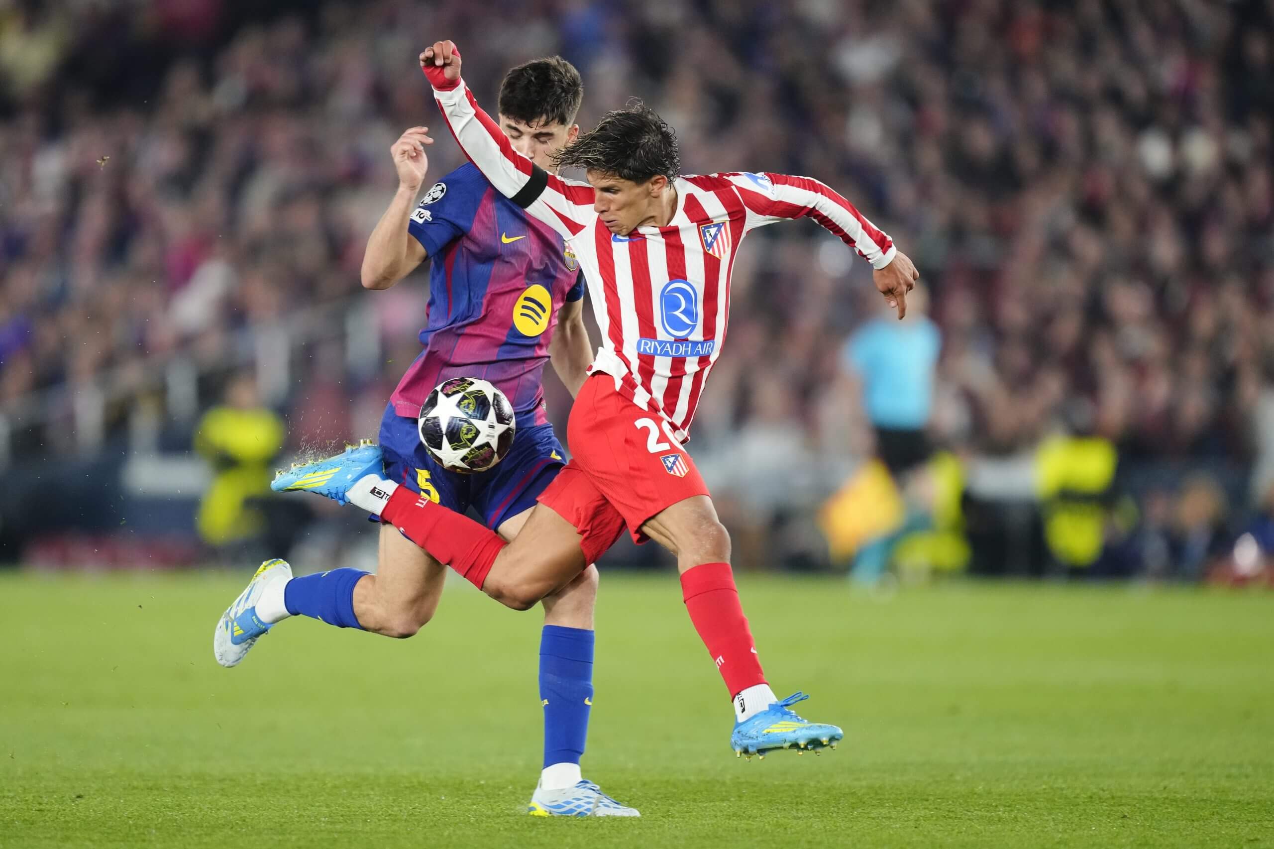 Barcelona defender Pau Cubarsi catches Atletico Madrid's Giuliano Simeone