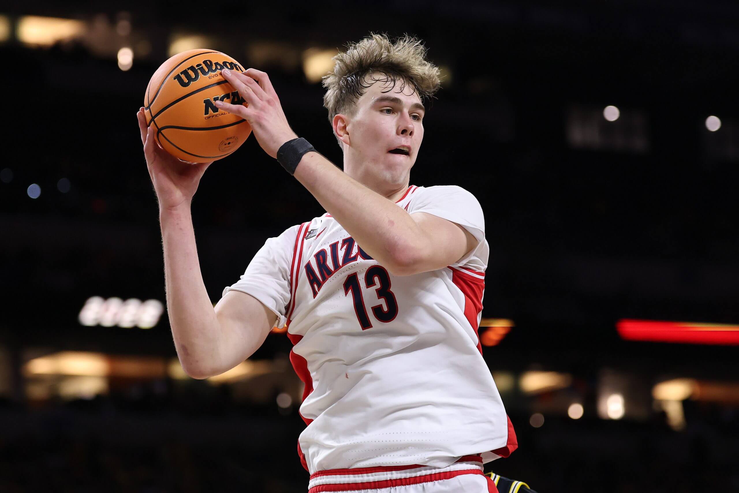 Motiejus Krivas clutches the ball in a game against Michigan.