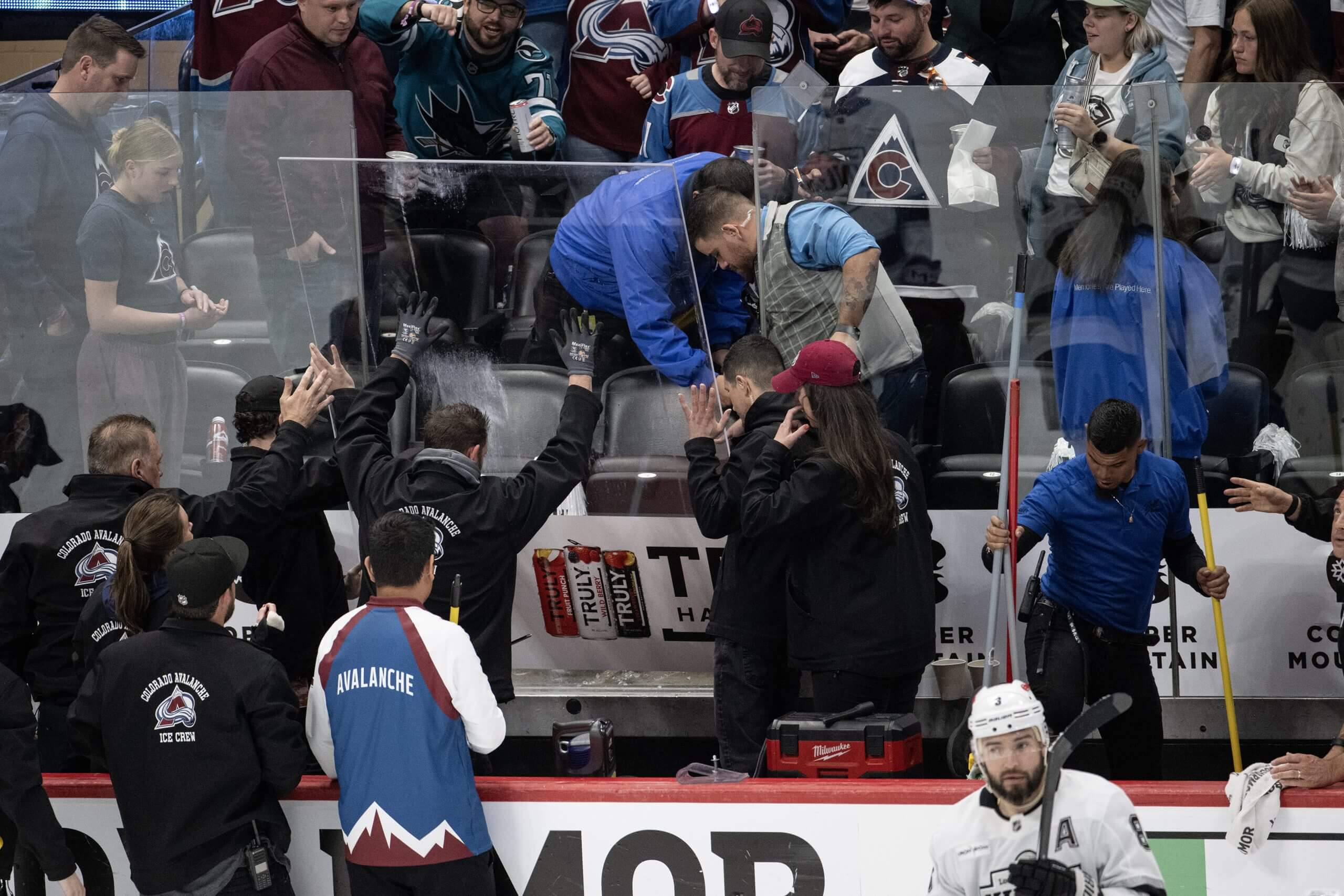 Arena crews replace a panel of glass at Ball Arena