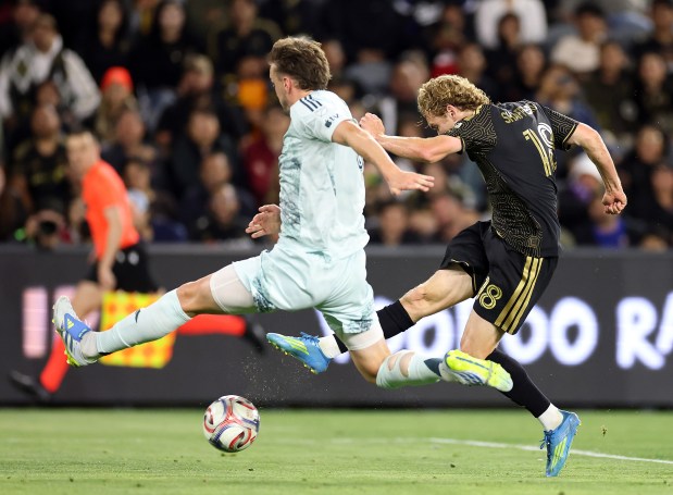LOS ANGELES, CALIFORNIA - APRIL 22: Jacob Shaffelburg #18 of the Los Angeles FC controls the ball against Rob Holding #6 of the Colorado Rapids in the second half at BMO Stadium on April 22, 2026 in Los Angeles, California. (Photo by Ronald Martinez/Getty Images)