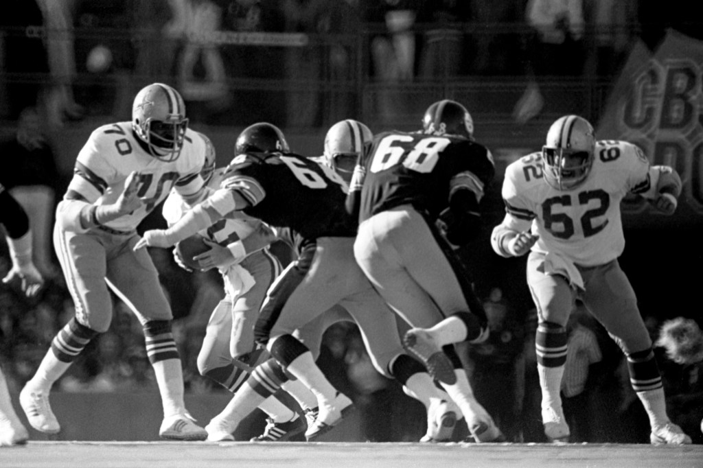Offensive linemen Rayfield Wright #70 and John Fitzgerald #62 of the Dallas Cowboys prepare to block defensive linemen Steve Furness #64 and L.C. Greenwood #68 of the Pittsburgh Steelers during Super Bowl X on January 18, 1976