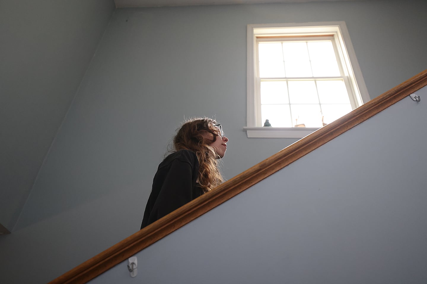 Kaylee Joaquim, photographed at her home, has trouble going up the stairs.