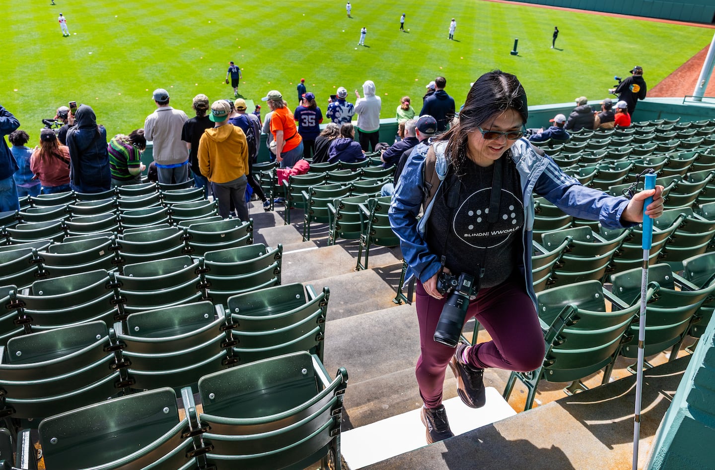 Caruso navigates the bleacher stairs at Fenway Park.