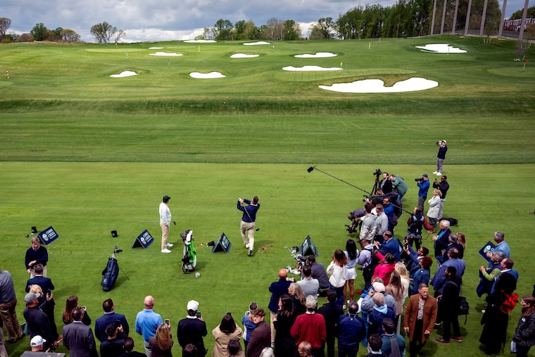 PGA Tour champion Chris Gotterup (left) and former Eagles center Jason Kelce (right) hit the inaugural tee shots at the driving range following the ribbon-cutting for the Lincoln Financial Center at Cobbs Creek Golf Course.