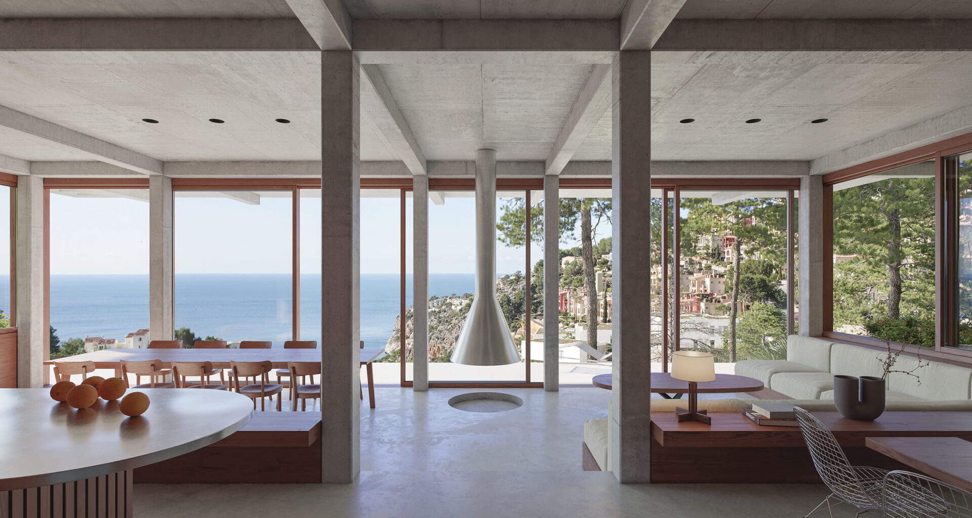 A concrete villa by Isla Architects overlooks the Balearic Sea