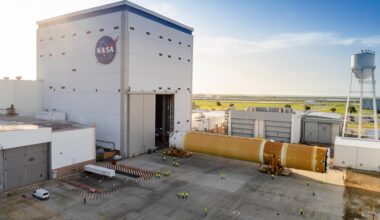 This photo shows NASA and Boeing, the SLS core stage lead contractor, preparing the SLS (Space Launch System) rocket core stage for shipment at NASA’s Michoud Assembly Facility in New Orleans. On July 6, NASA and Boeing moved the Artemis II rocket stage to Building 110. The move comes as teams prepare to roll the massive rocket stage with its four RS-25 engines to the agency’s Pegasus barge for delivery to NASA’s Kennedy Space Center in Florida in mid-July. Prior to the move, technicians began removing external access stands, or scaffolding, surrounding the core stage to assess the interior elements, including its complex avionics and flight propulsion systems. The stage is fully manufactured at NASA Michoud.