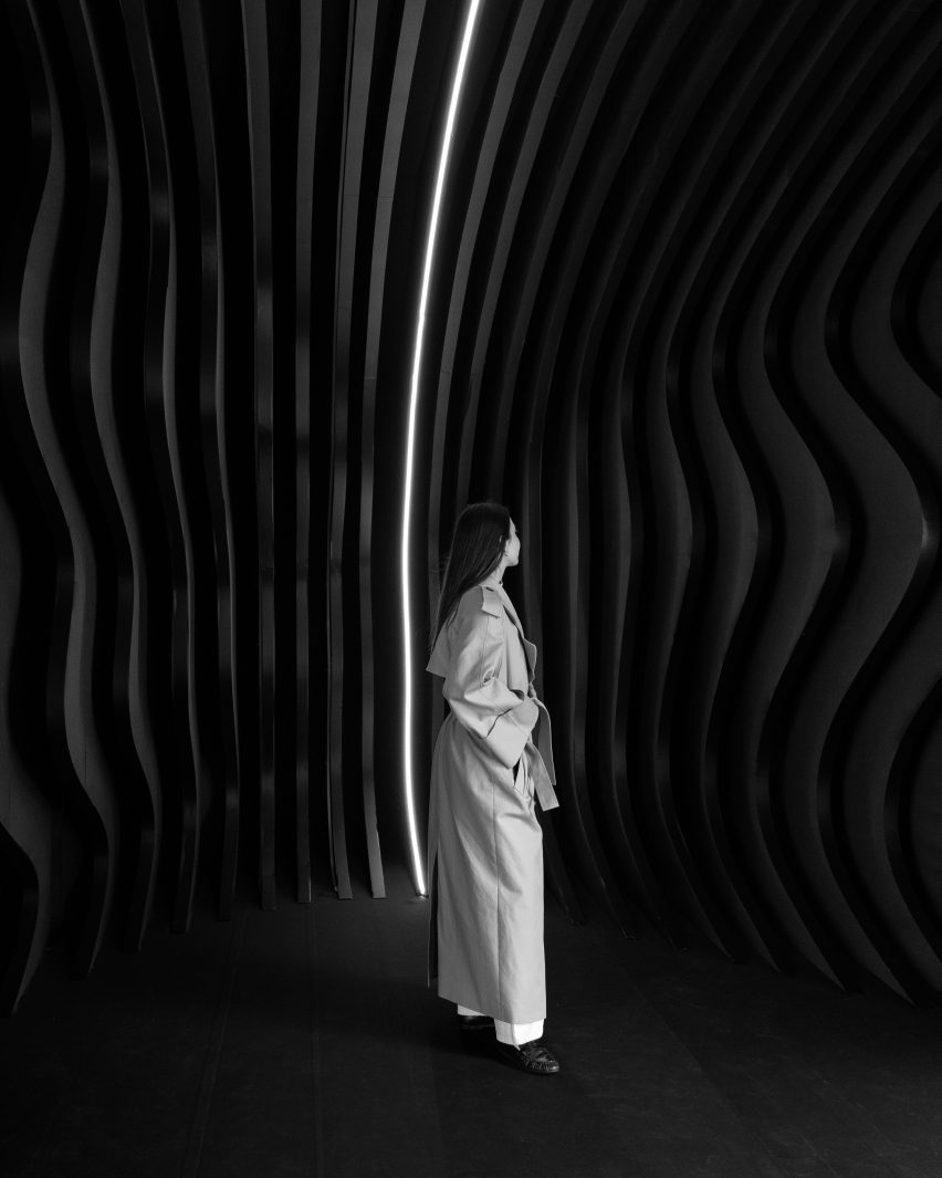 Person standing inside installation