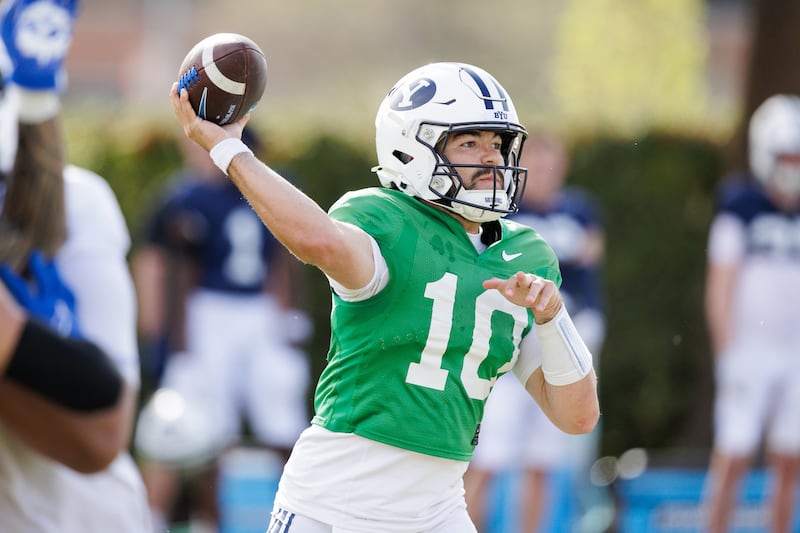 BYU quarterback Treyson Bourguet delivers a pass during practice March 27, 2026, at the outdoor practice facility in Provo, Utah.