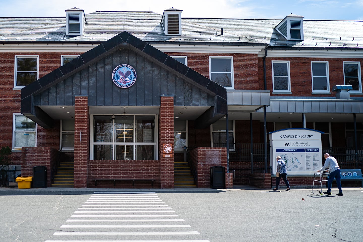 People entered the Liberty Building at Northampton VA Medical Center in Leeds. The building is home to “sick call,” which resembles an urgent care for veterans.