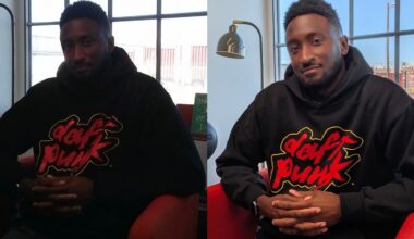 A man wearing a black Daft Punk hoodie sits in a red chair with his hands clasped. The left side of the image is dark, while the right side is bright and clear, showing improved lighting.