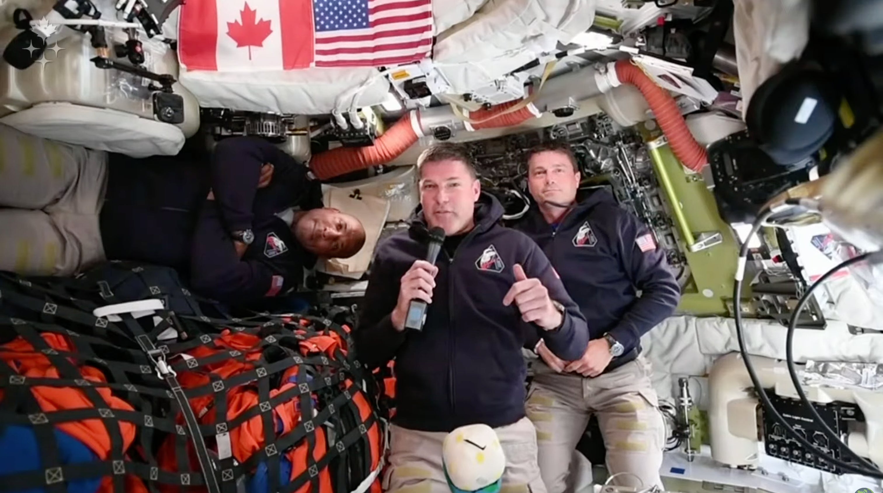 The Artemis II men are interviewed aboard their Orion spacecraft