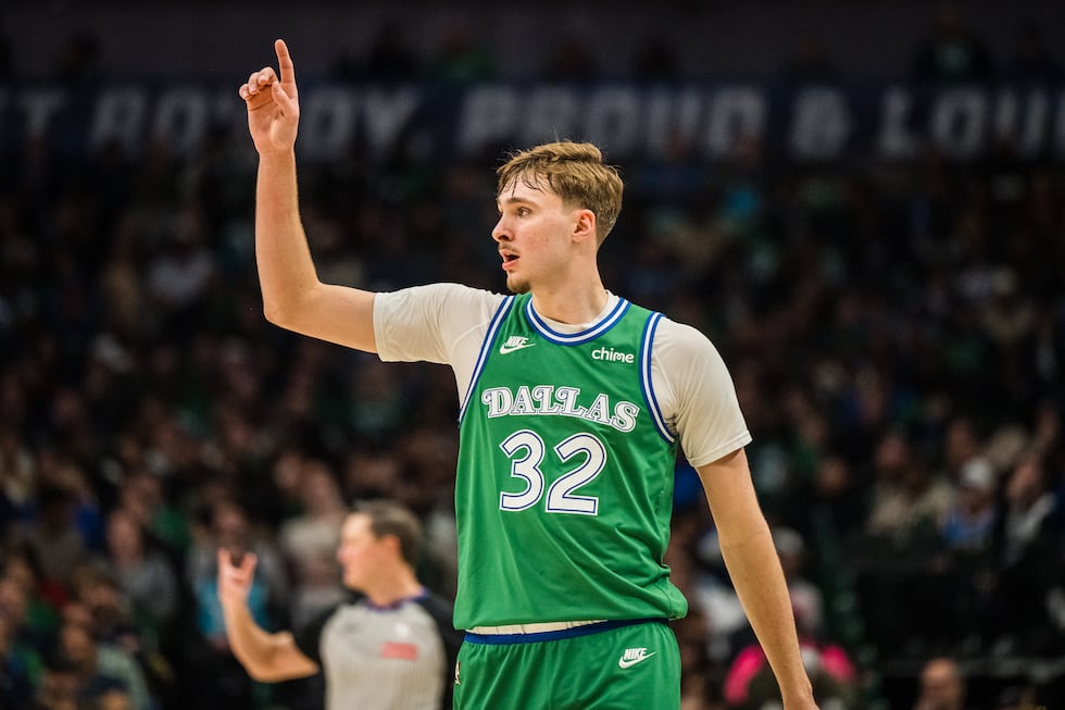 Dallas Mavericks forward Cooper Flagg gestures during an NBA basketball game against the...