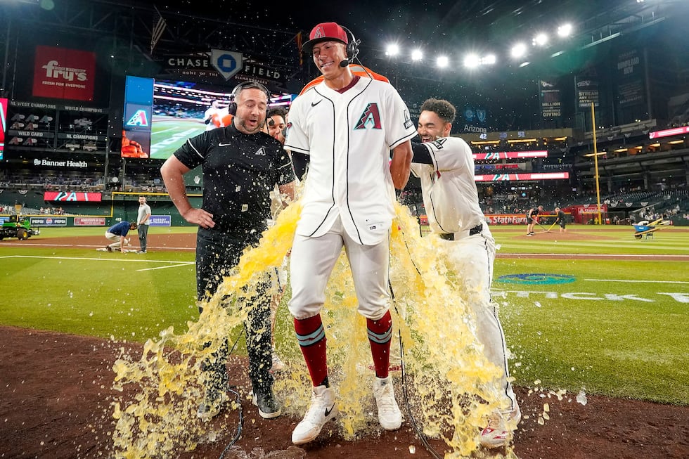 Arizona Diamondbacks' Jose Fernandez gets a gatorade bath after hitting two home runs and four...