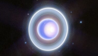 a blue-white orb on a starry background, surrounded by rings of lite