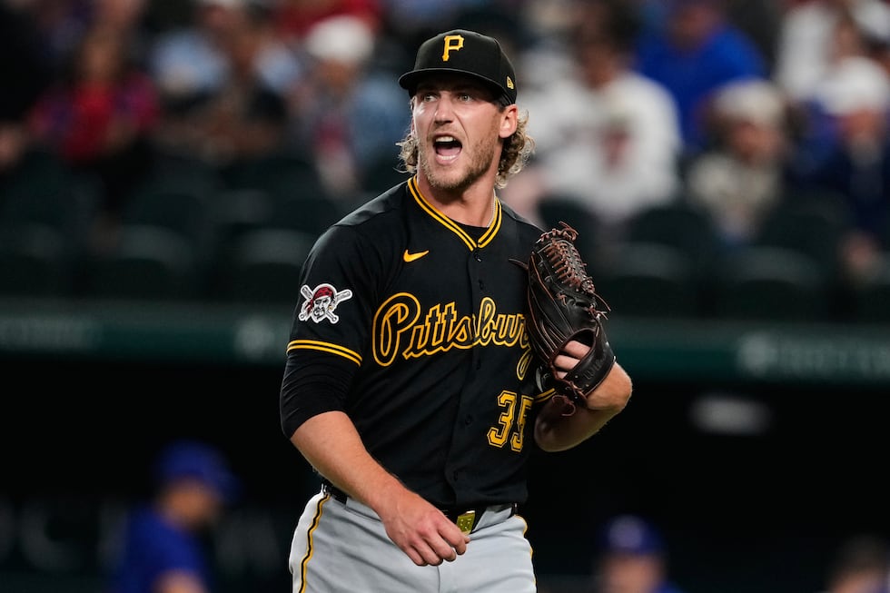 Pittsburgh Pirates' Braxton Ashcraft interacts with a teammate after striking out Texas...