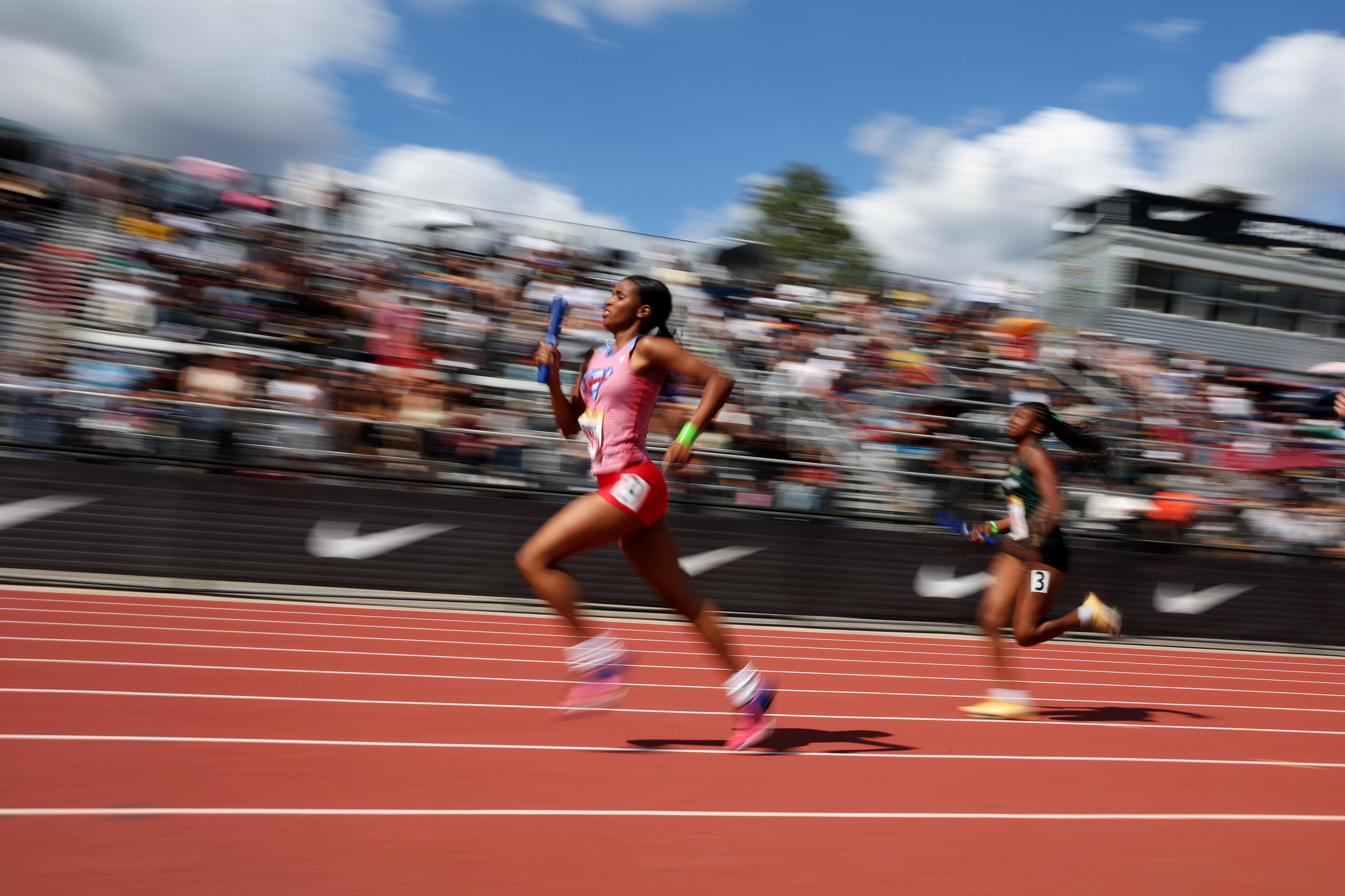Runners compete in the girls 4×400 relay during the Arcadia...
