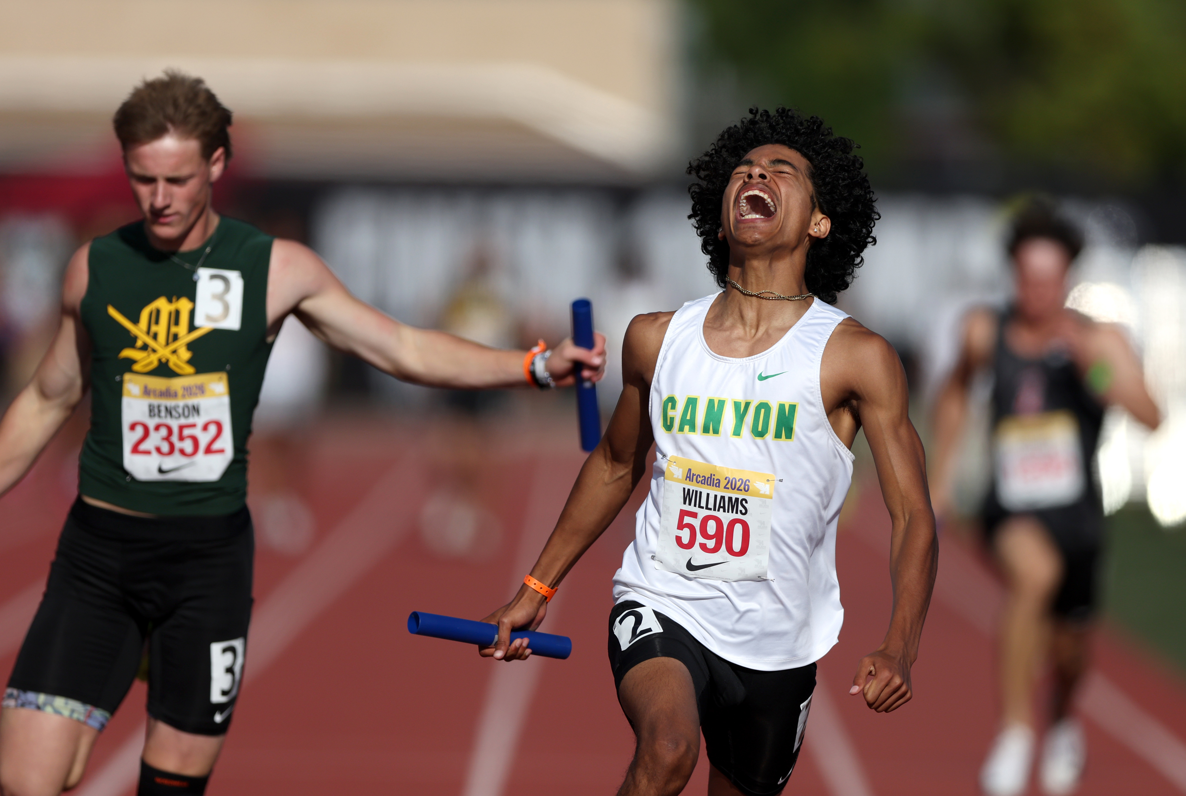 Canyonâs Caleb Williams celebrates while crossing the finish line in...
