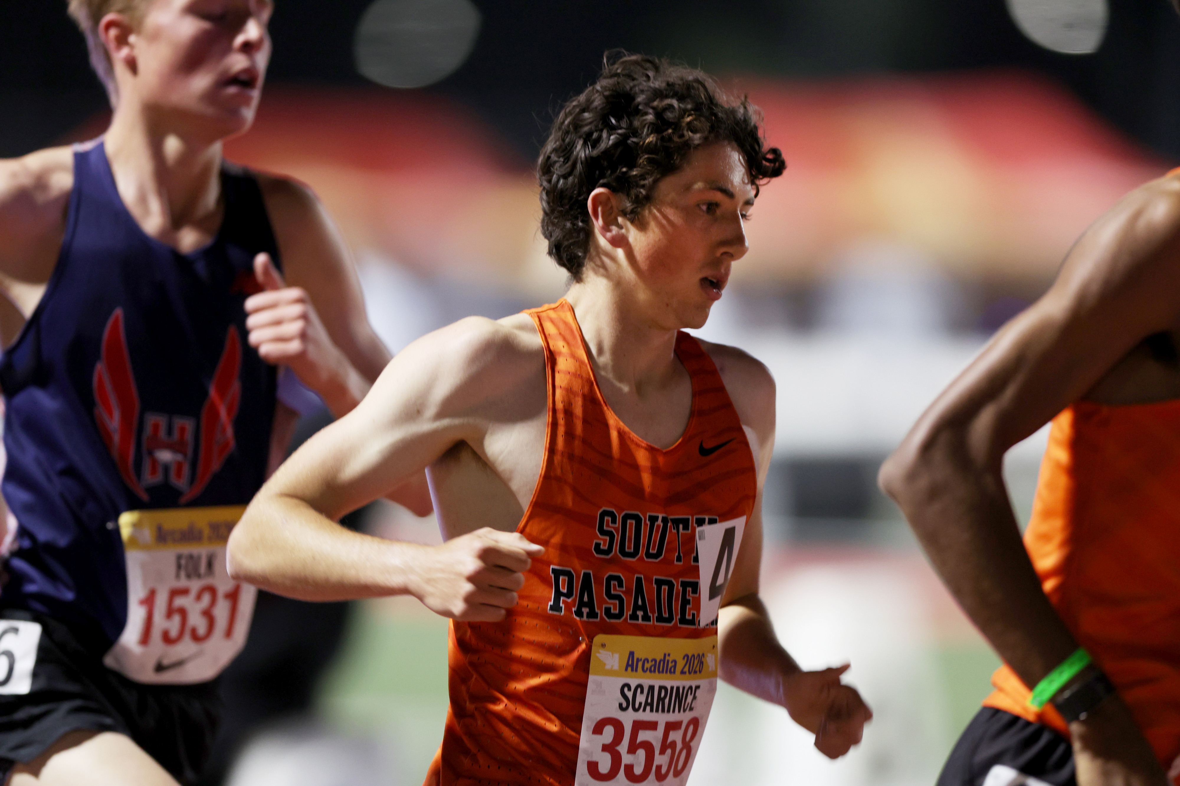 South Pasadenaâs Michael Scarince, center, competes in the boys 3,200...