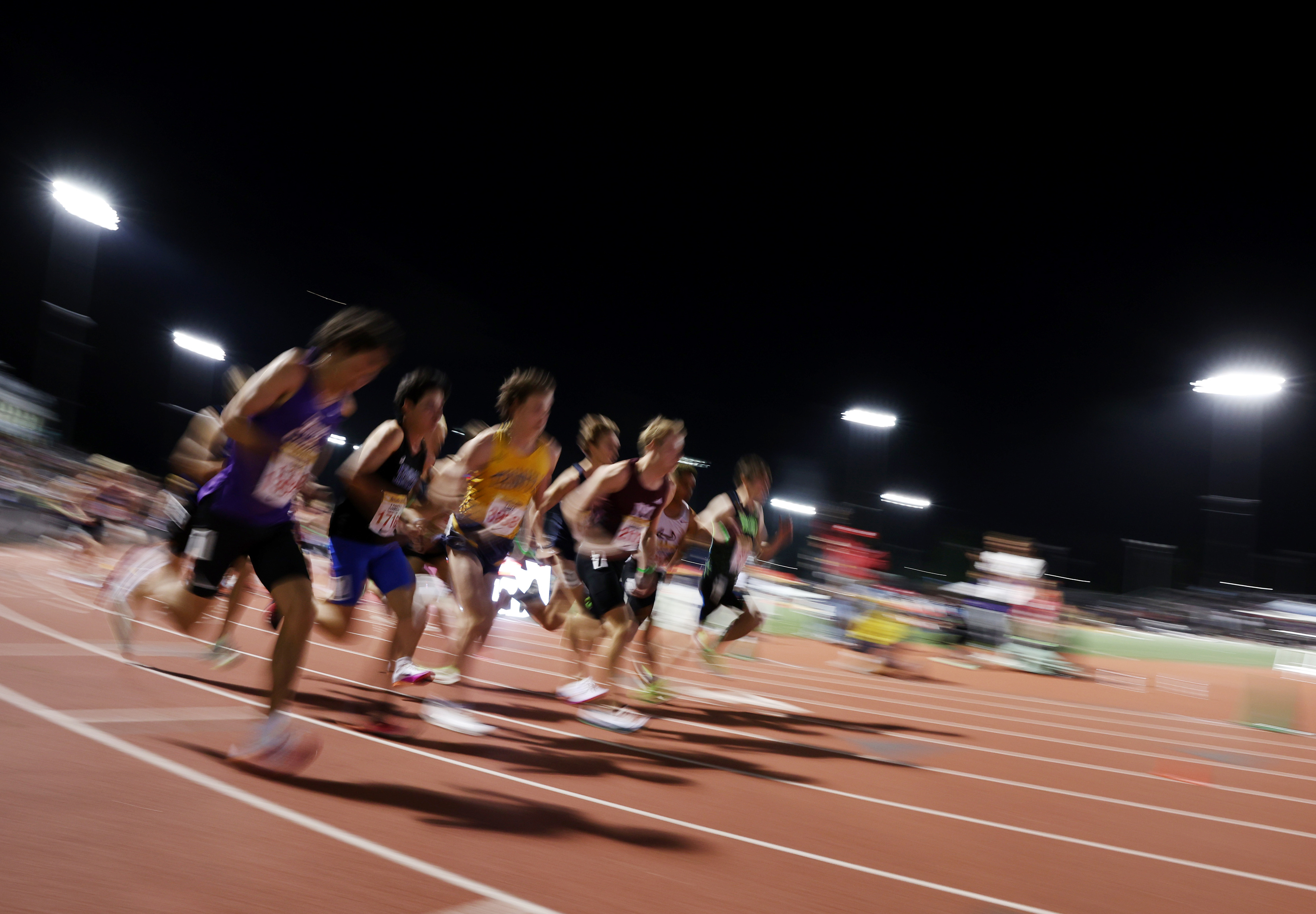 Runners compete in the boys 3200 meter run rated during...