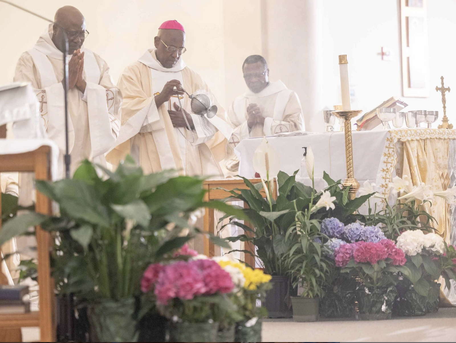 Bishop Jerome Feudjio of the Diocese of St. Thomas in the U.S. Virgin Islands incenses the altar during a Mass of Thanksgiving at St. Joseph Catholic Church in Beltsville, Maryland, on April 17, 2026 that commemorated the bishop’s 70th birthday and his fifth anniversary leading that diocese. (Catholic Standard photo by Mihoko Owada)