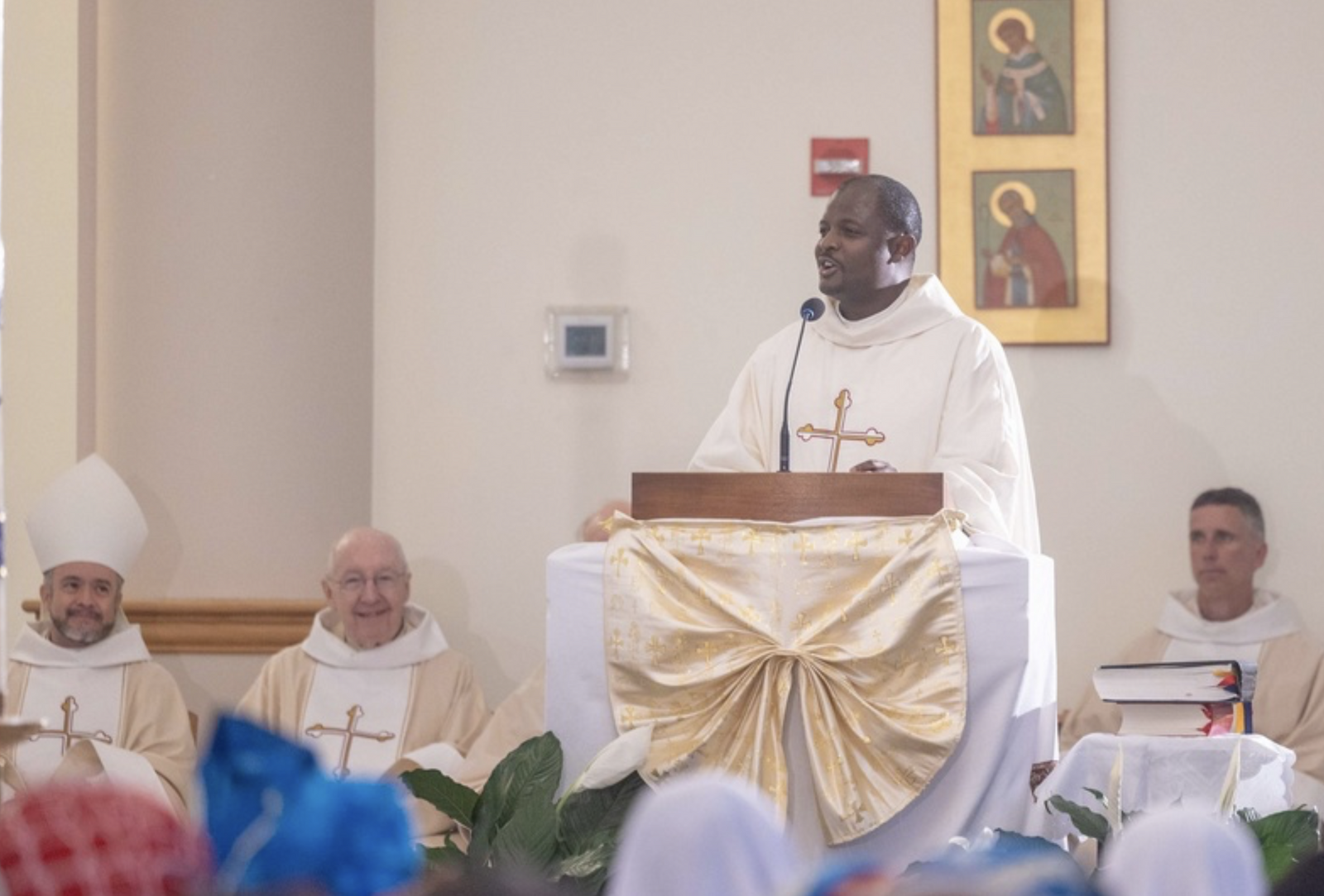 Father Valery Akoh, the pastor of St. Matthew Parish in Tyrone, Georgia, gives the homily during a Mass of Thanksgiving at St. Joseph Catholic Church in Beltsville, Maryland, on April 17, 2026 that commemorated the 70th birthday of Bishop Jerome Feudjio of the Diocese of St. Thomas in the U.S. Virgin Islands and his fifth anniversary leading that diocese. Like Bishop Feudjio, Father Akoh is a native of the African nation of Cameroon. (Catholic Standard photo by Mihoko Owada)