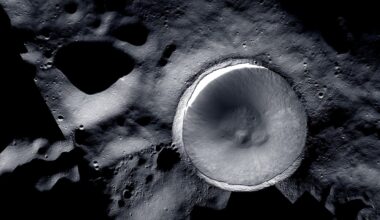 a large crater on the grey, cratered surface of the moon