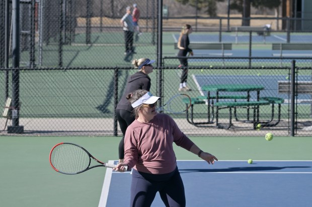 Kate Kalstein, front, plays tennis at Gates Tennis Center in Denver on Thursday, Feb. 5, 2026. (Photo by Hyoung Chang/The Denver Post)